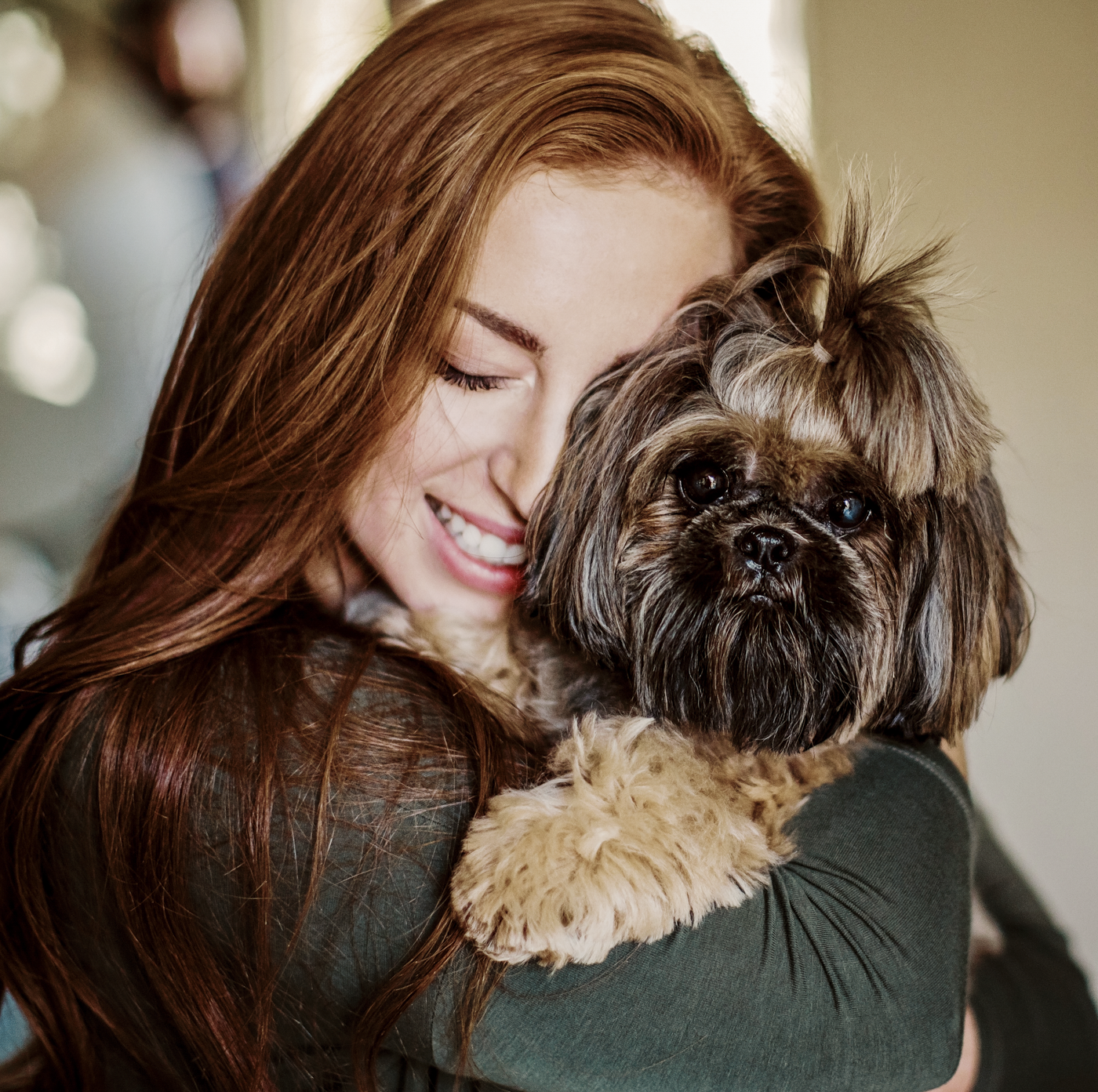 KL_Animals_woman hugging terrier dog